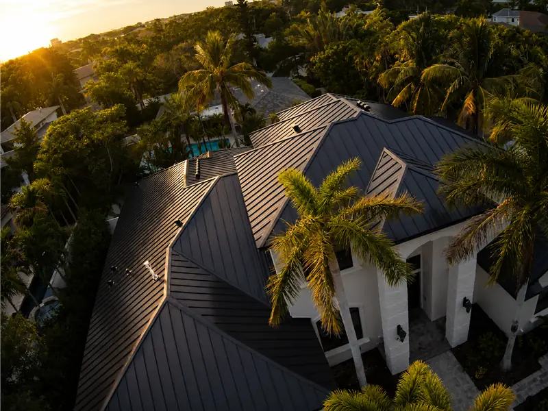 Black standing-seam metal roof on a two-story home