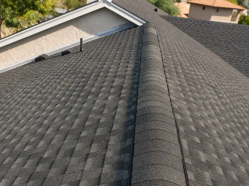 Architectural asphalt shingle roof with ridge venting