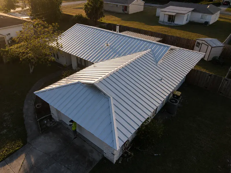 White standing-seam metal roof install